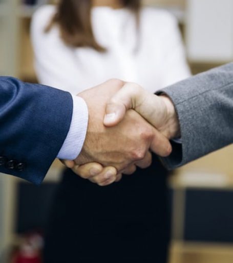 businessmen-handshaking-after-deal-agreement-2022-04-22-04-25-23-utc (1)